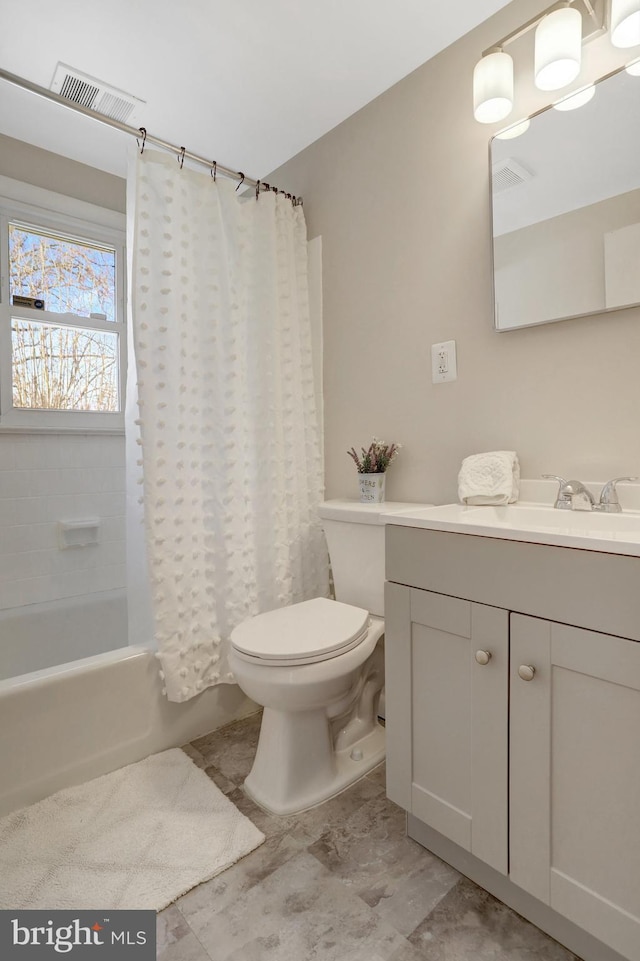 full bathroom with vanity, toilet, shower / bathtub combination with curtain, and visible vents