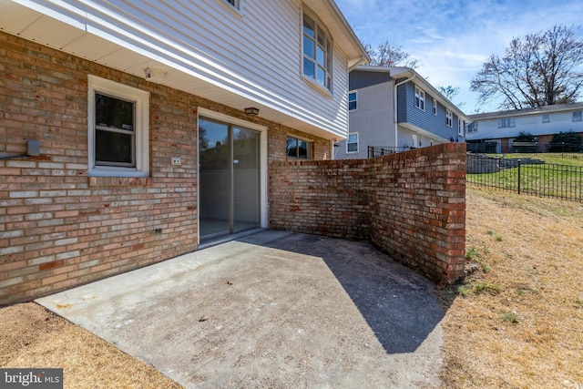 view of patio featuring fence