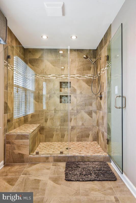 bathroom with a shower stall