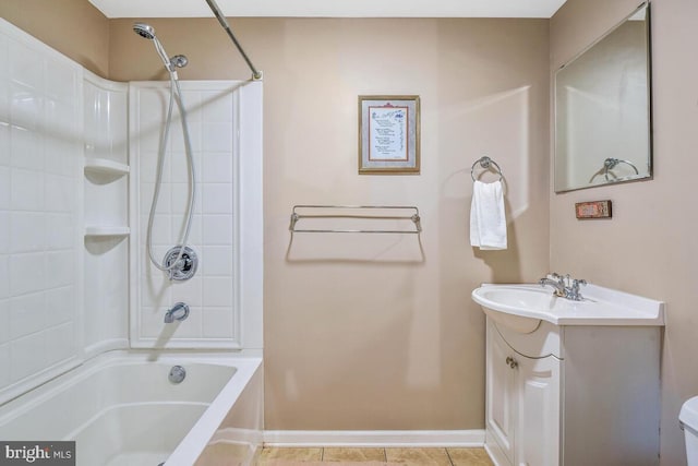 bathroom with toilet,  shower combination, tile patterned flooring, baseboards, and vanity