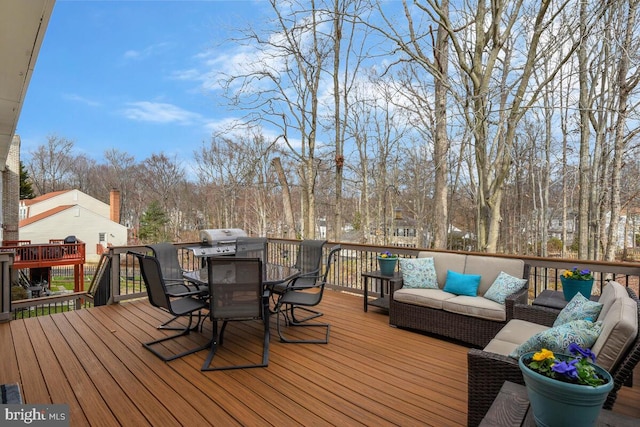 wooden terrace with outdoor lounge area