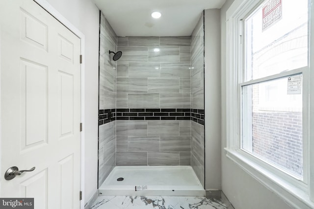 bathroom featuring recessed lighting, a tile shower, marble finish floor, and baseboards