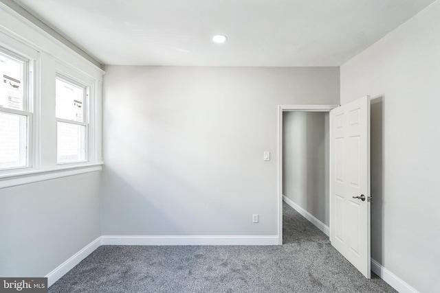 carpeted spare room with baseboards and recessed lighting