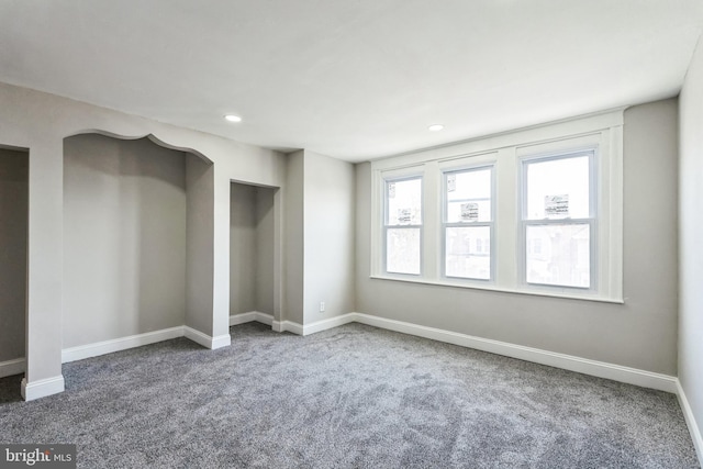 unfurnished bedroom with recessed lighting, carpet flooring, and baseboards