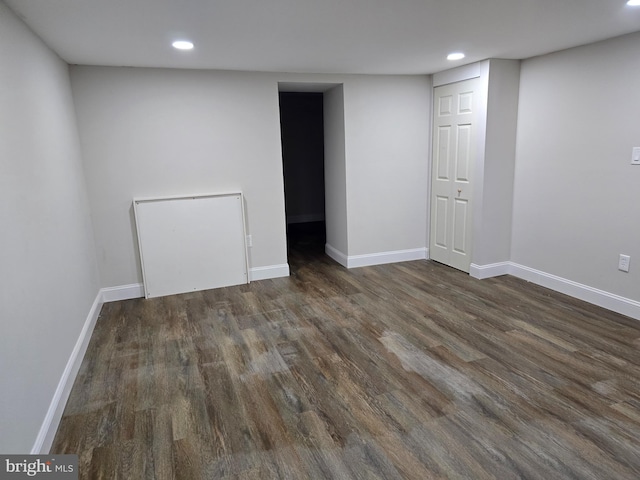 below grade area with wood finished floors, baseboards, and recessed lighting