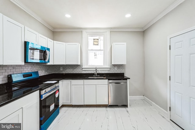 kitchen featuring marble finish floor, dark countertops, a sink, decorative backsplash, and appliances with stainless steel finishes