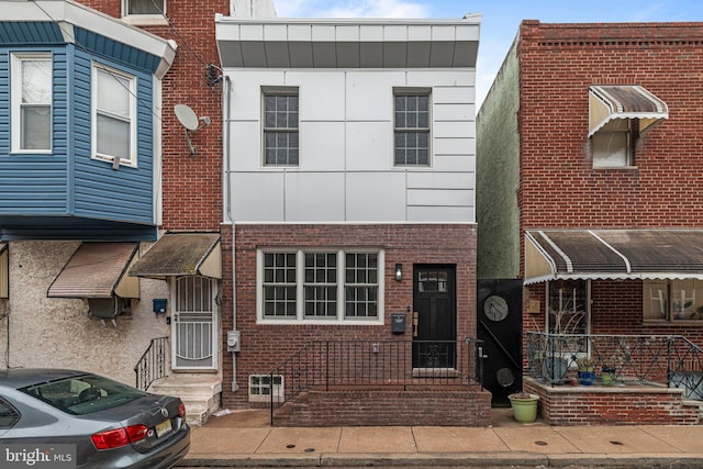 multi unit property featuring brick siding