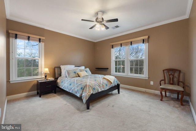 bedroom featuring a ceiling fan, visible vents, baseboards, crown molding, and light colored carpet