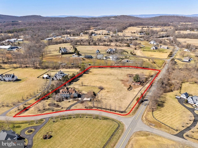 birds eye view of property with a rural view and a mountain view