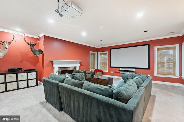 cinema room featuring light carpet, ornamental molding, recessed lighting, a fireplace, and baseboards