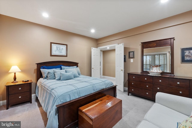 bedroom with recessed lighting, baseboards, and light colored carpet