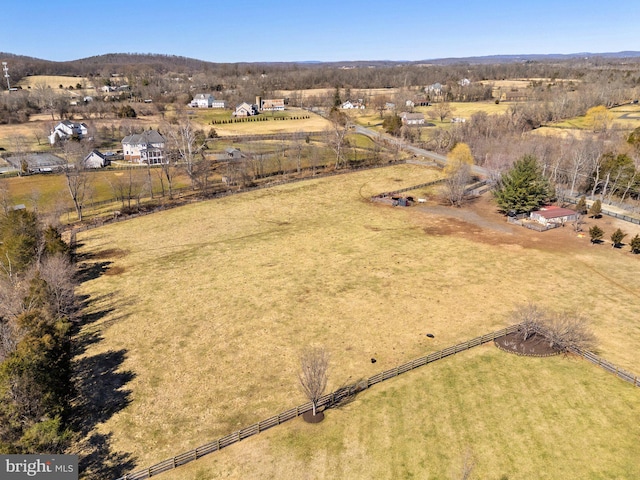 birds eye view of property with a rural view