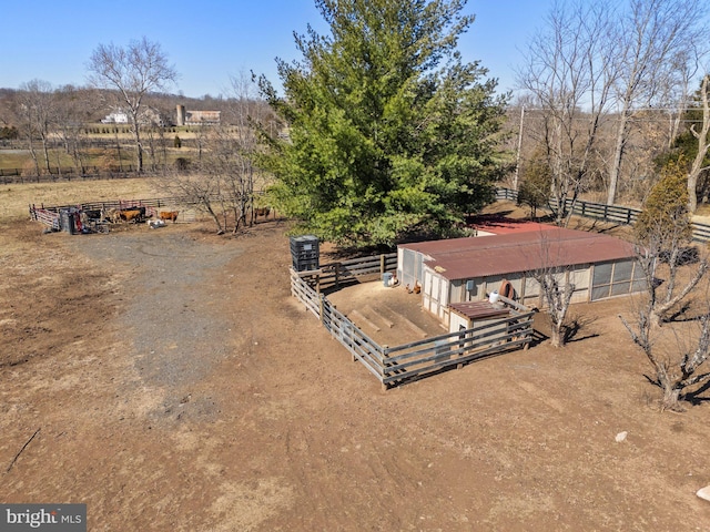 birds eye view of property with a rural view