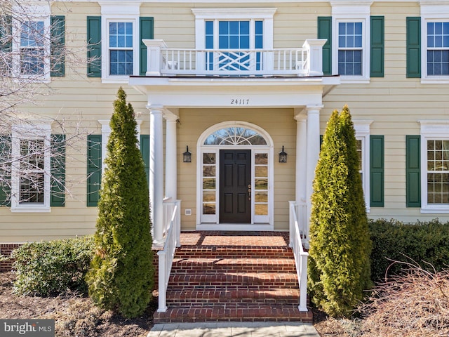 doorway to property featuring a balcony