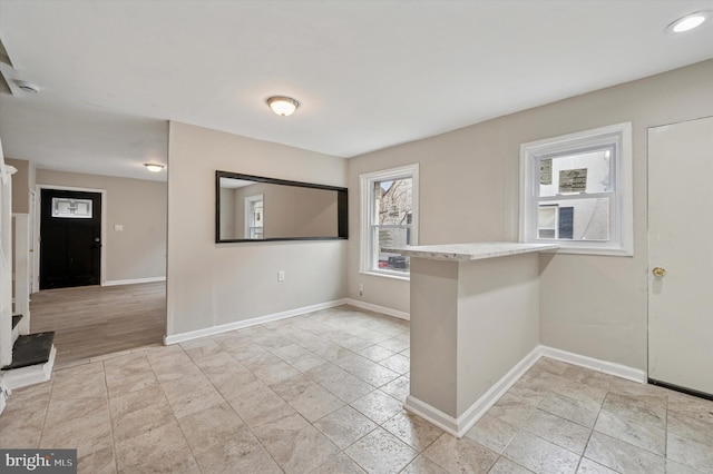 empty room featuring baseboards