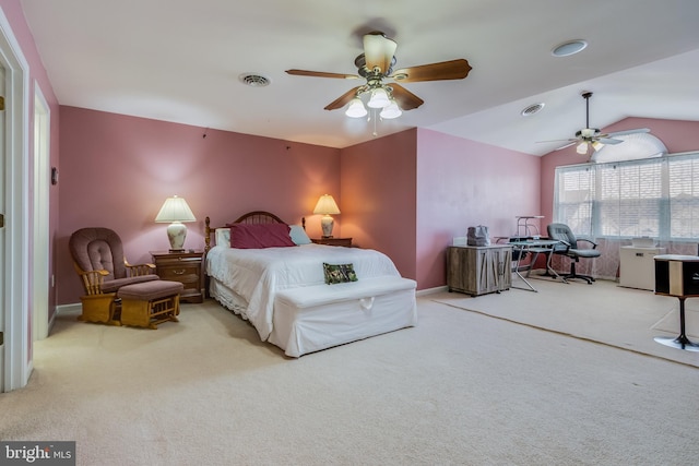 carpeted bedroom with vaulted ceiling, ceiling fan, visible vents, and baseboards