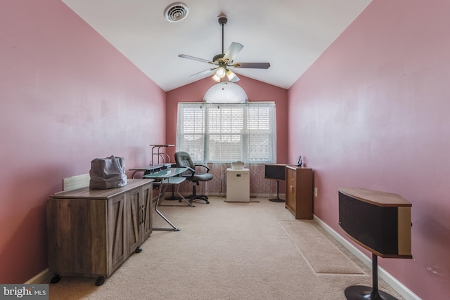 home office with light carpet, baseboards, visible vents, a ceiling fan, and vaulted ceiling