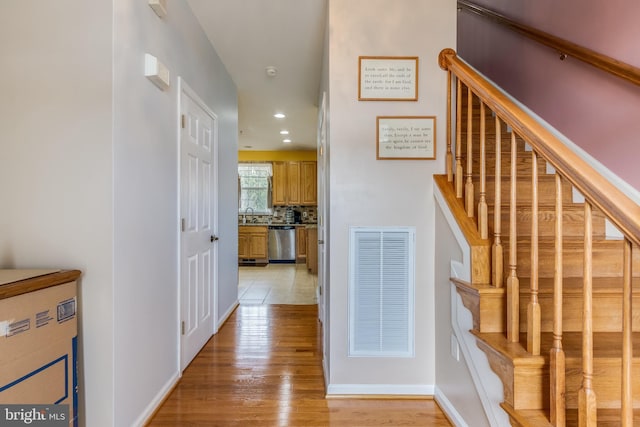 interior space featuring recessed lighting, wood finished floors, visible vents, and baseboards