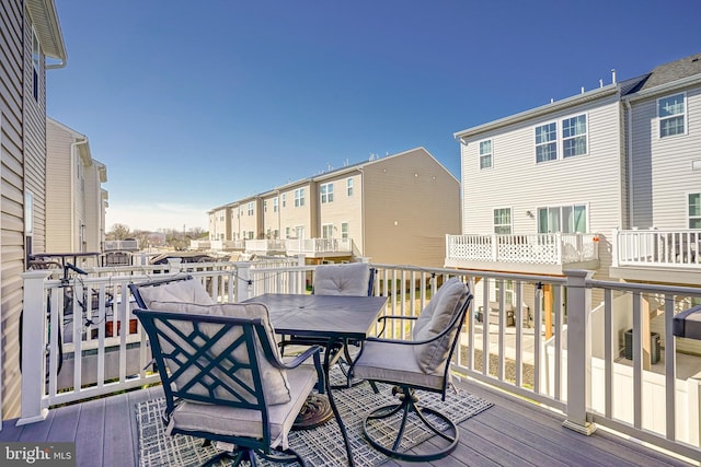 wooden deck with a residential view