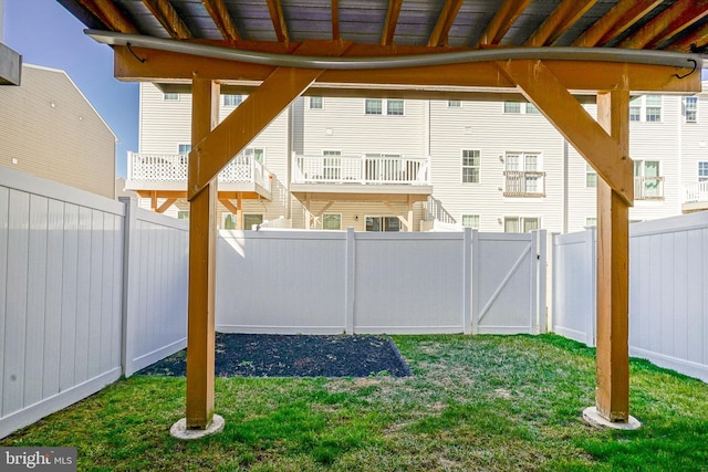 view of yard with a gate and a fenced backyard