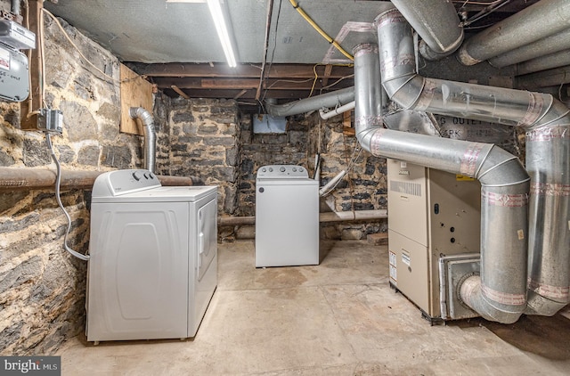 unfinished basement featuring washer and dryer