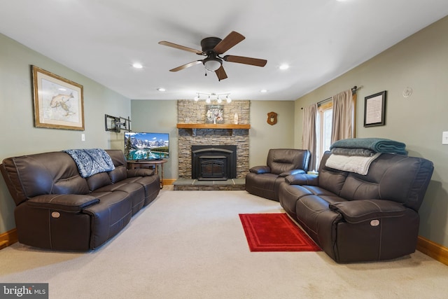 carpeted living area with a fireplace, baseboards, a ceiling fan, and recessed lighting