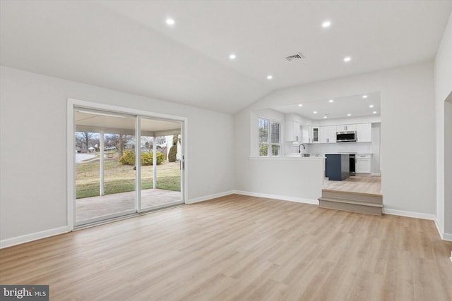 unfurnished living room with light wood-style floors, recessed lighting, visible vents, and baseboards