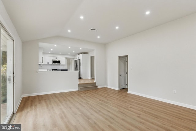 unfurnished living room with lofted ceiling, recessed lighting, visible vents, baseboards, and light wood finished floors