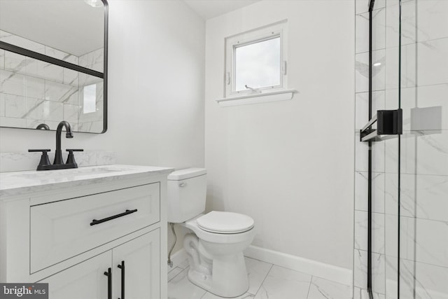 bathroom with baseboards, toilet, marble finish floor, a tile shower, and vanity