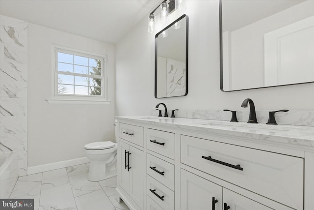 full bathroom with marble finish floor, a sink, toilet, and double vanity