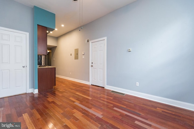 interior space featuring baseboards, visible vents, dark wood-style flooring, and recessed lighting