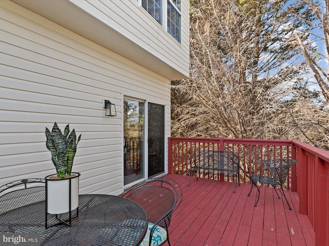 deck featuring outdoor dining area