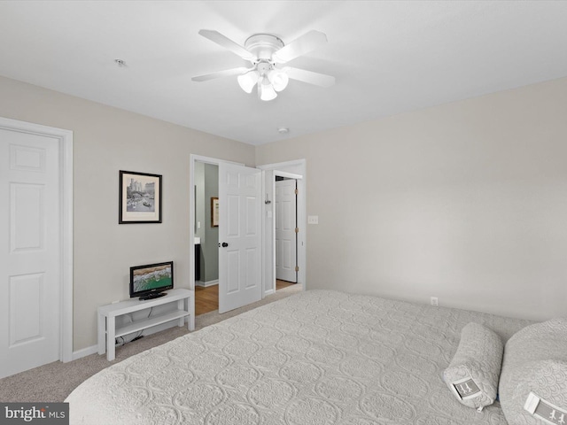 carpeted bedroom with baseboards and a ceiling fan