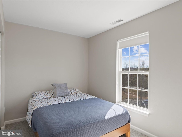 bedroom featuring carpet flooring, baseboards, and visible vents