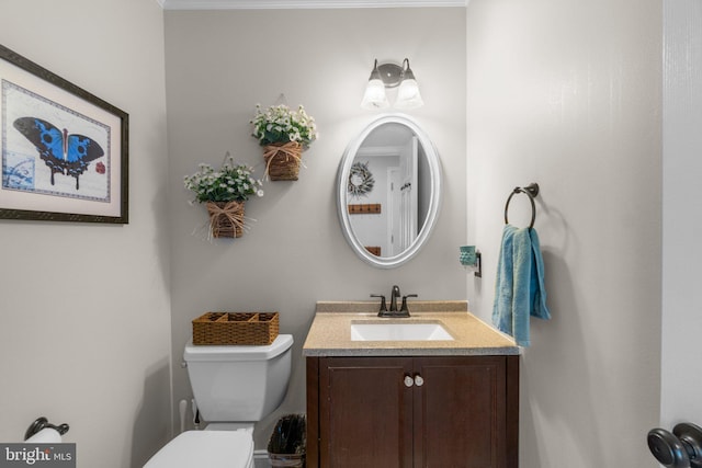 half bath with vanity and toilet