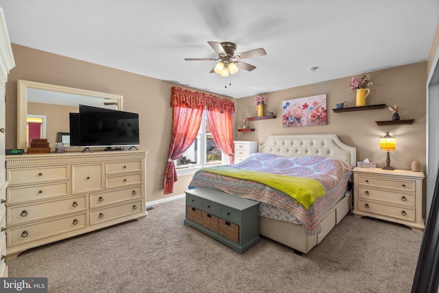 bedroom featuring ceiling fan, baseboards, and light carpet