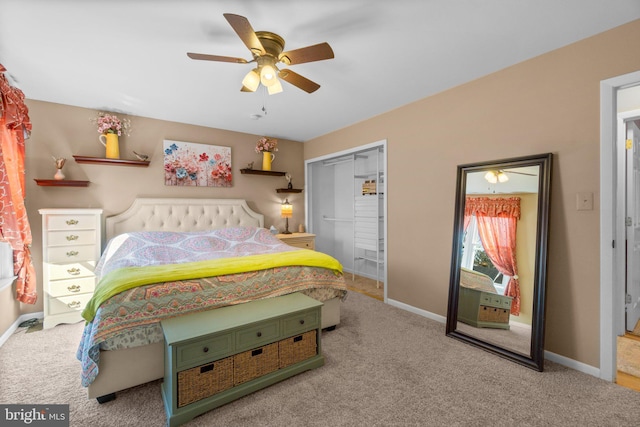 carpeted bedroom featuring a closet, baseboards, and ceiling fan