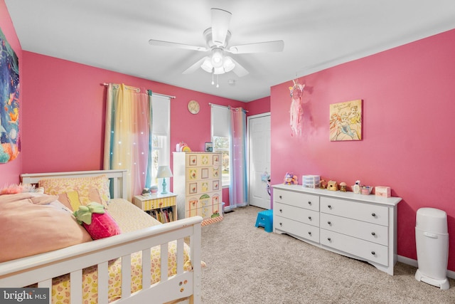 bedroom with baseboards, carpet floors, and a ceiling fan