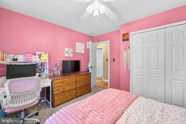 bedroom with a closet, carpet, and ceiling fan