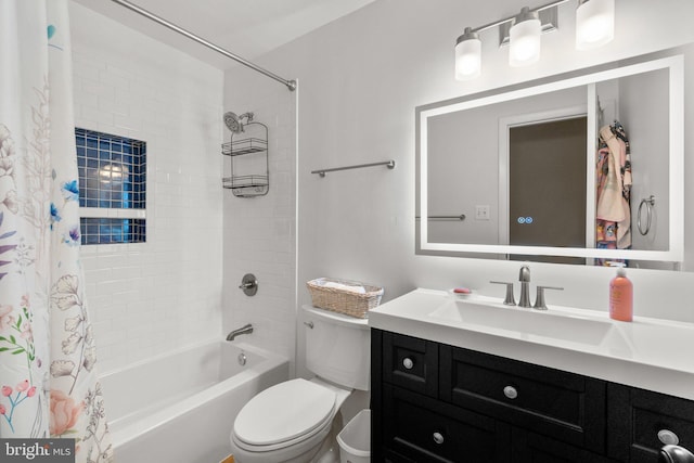 full bath featuring toilet, vanity, and shower / bath combination with curtain