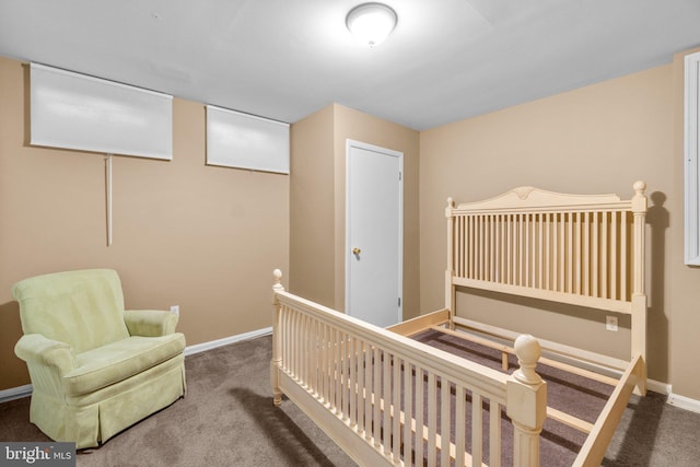 bedroom with baseboards and carpet