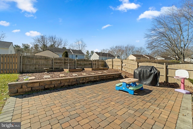 view of patio / terrace featuring area for grilling and a fenced backyard