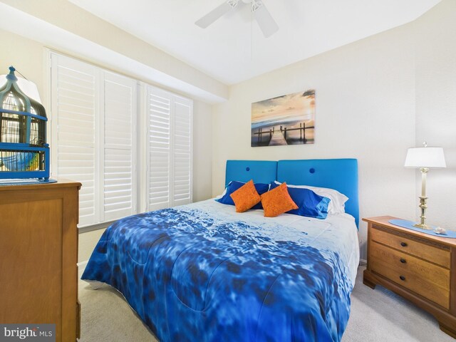 carpeted bedroom featuring ceiling fan