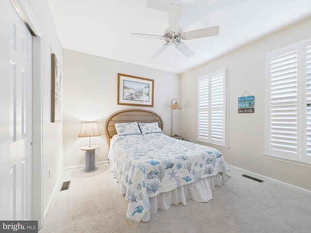 bedroom featuring carpet, visible vents, and baseboards