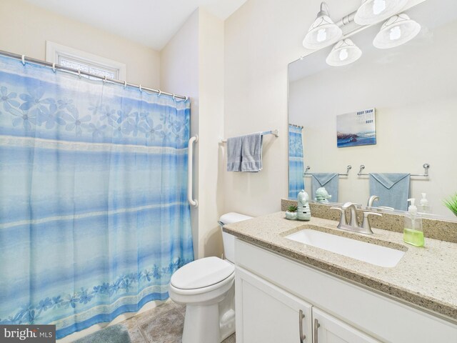 full bathroom with a shower with shower curtain, tile patterned flooring, vanity, and toilet