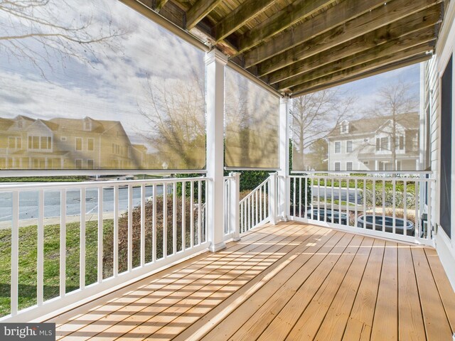 wooden deck featuring a residential view