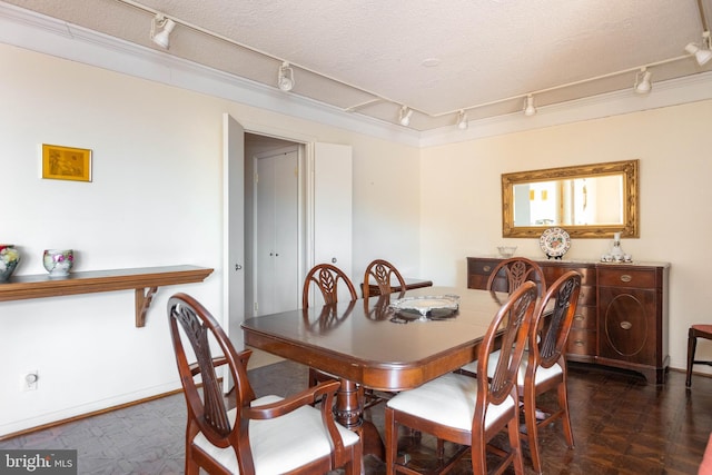 dining room with a textured ceiling