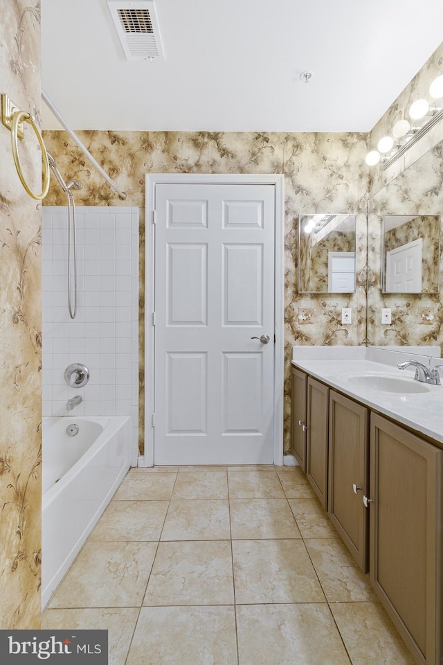 full bathroom with shower / tub combination, vanity, visible vents, tile patterned floors, and wallpapered walls