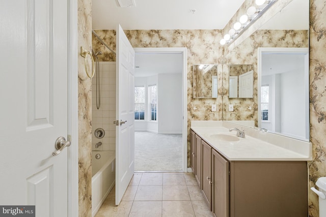 full bathroom with  shower combination, tile patterned floors, vanity, and wallpapered walls