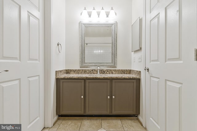 bathroom featuring tile patterned floors and vanity